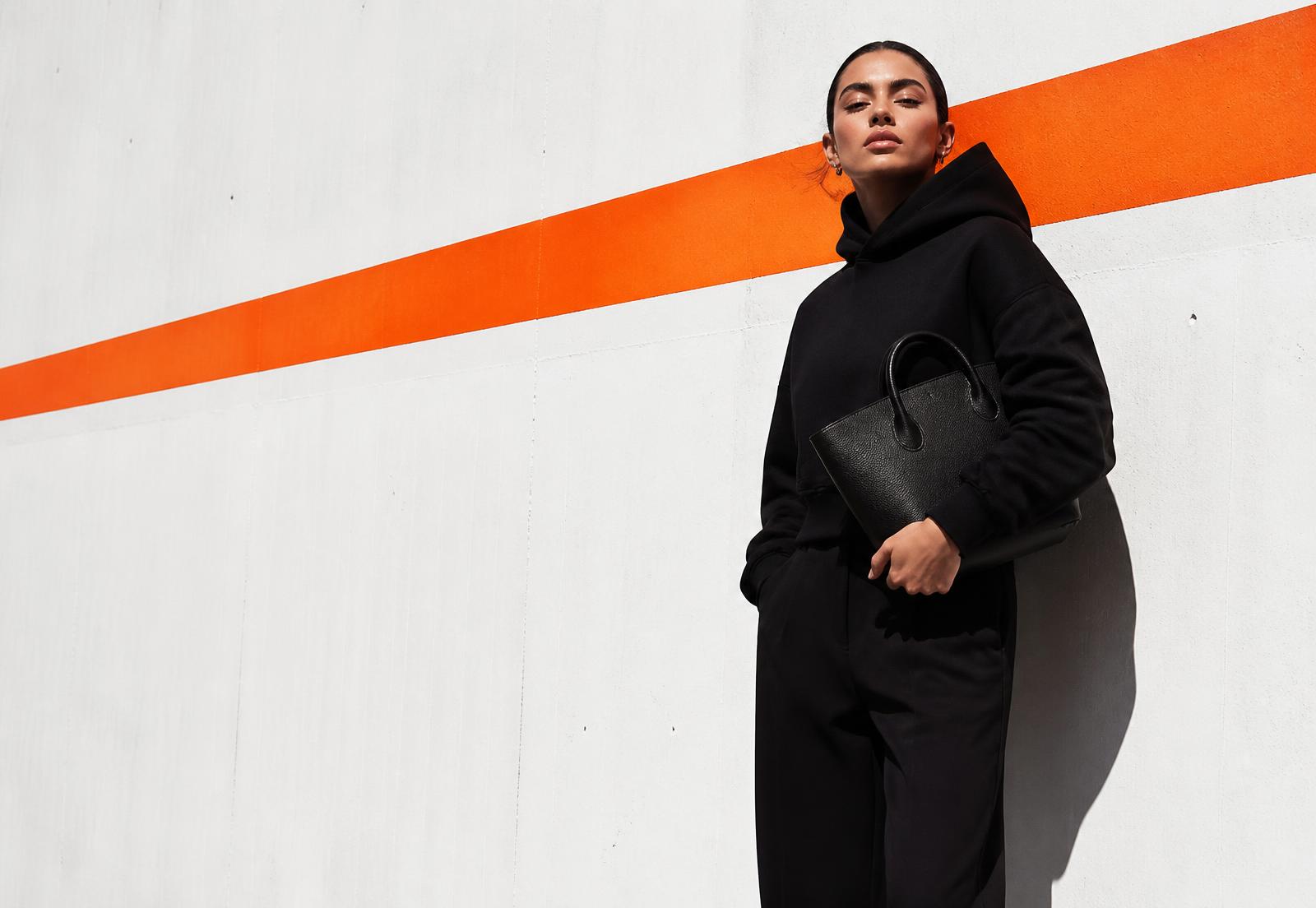 Woman holding a soft leather handbag